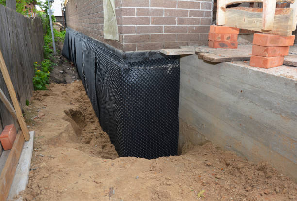 SJ Waterproofing Pros technician performing targeted Waterproofing assessment in Martinsburg, OH